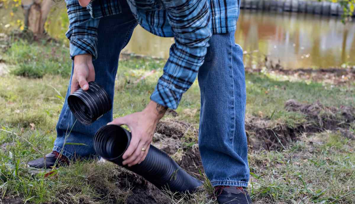 man installing a french drain