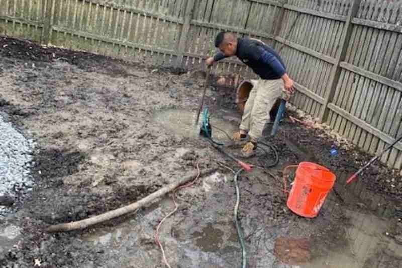 man working on residential drainage projet