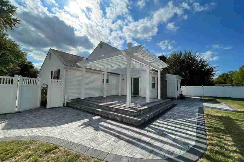 white pergola in back yard